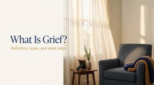 Calm illustration representing grief and remembrance, with the words What Is Grief over a soft ivory and deep blue background